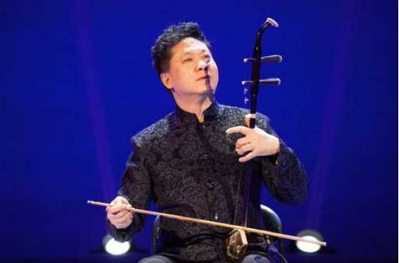这个二胡简谱符号是什么意思啊?有图片